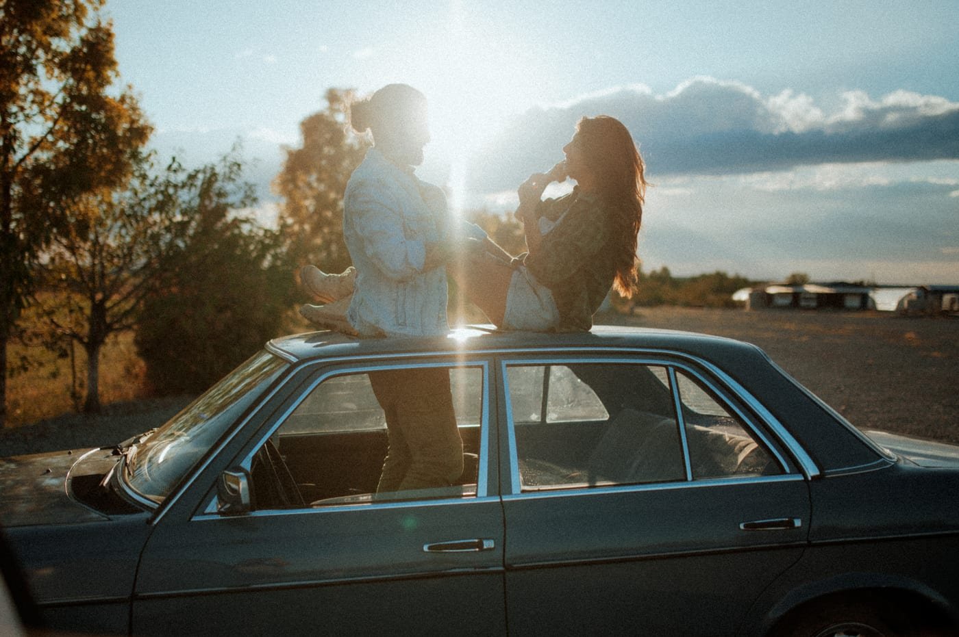 Romantic couple sharing an intimate moment at golden hour under the Texas sky in Abilene