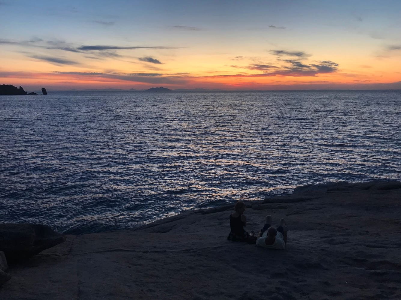 Romantic couple enjoying a quiet lakeside conversation at sunset on Lake Lewisville, Texas